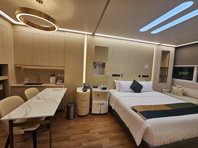A modern private hospital room at Bumrungrad International Hospital in Thailand, showing the high standard of care accessible with travel insurance.