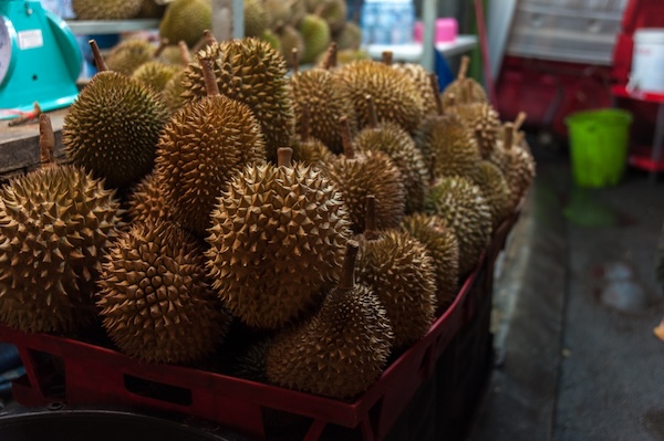 Thai durians stacked at a local market