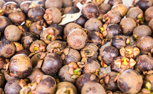 Fresh mangosteens at a Thai local market